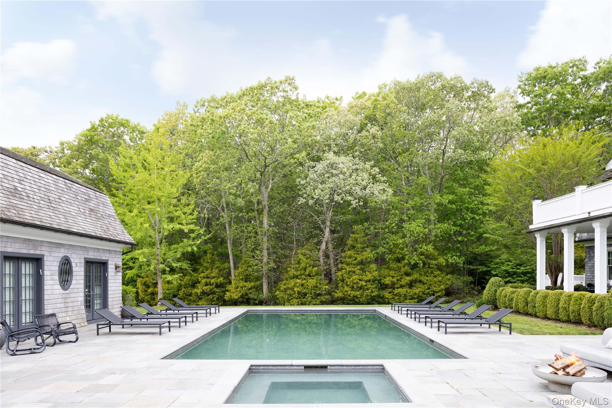 486 Middle Line Highway Bridgehampton, NY 11976 - Photo 4 of 25 a view of a swimming pool with a patio