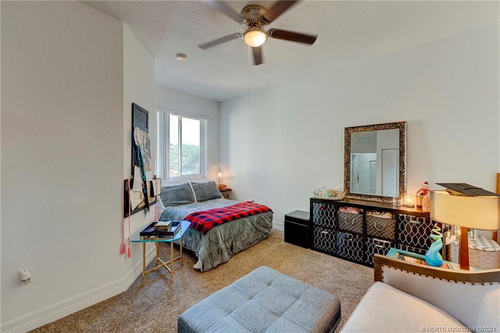 55 Southeast Palermo, Unit 102 Stuart, FL 34994 - Photo 17 of 40 a bedroom with furniture and a window