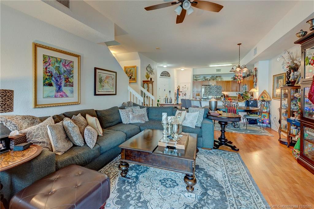 55 Southeast Palermo, Unit 102 Stuart, FL 34994 - Photo 21 of 40 a living room with furniture and a rug