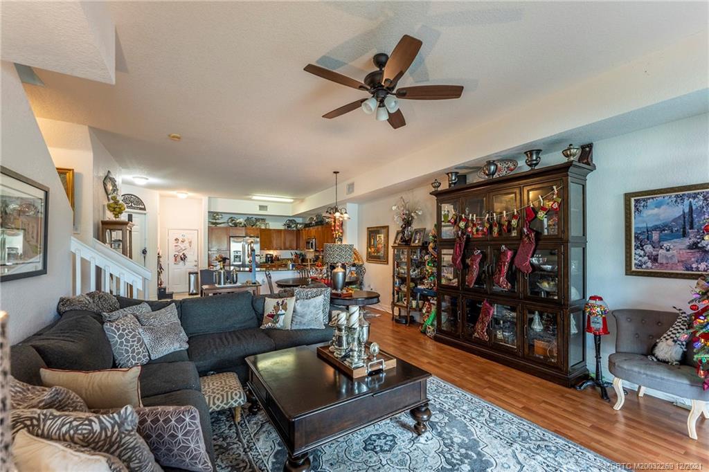 55 Southeast Palermo, Unit 102 Stuart, FL 34994 - Photo 29 of 40 a living room with furniture and a ceiling fan