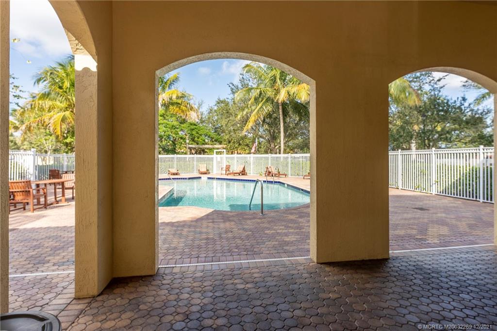 55 Southeast Palermo, Unit 102 Stuart, FL 34994 - Photo 3 of 40 a view of entrance gate with a garden