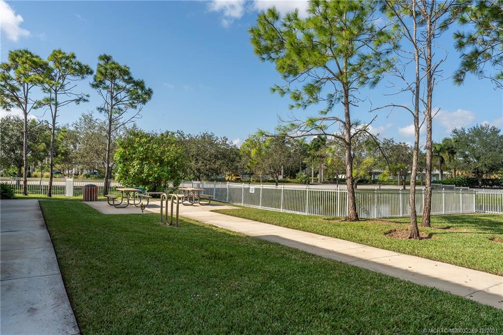 55 Southeast Palermo, Unit 102 Stuart, FL 34994 - Photo 36 of 40 a view of lake with a yard