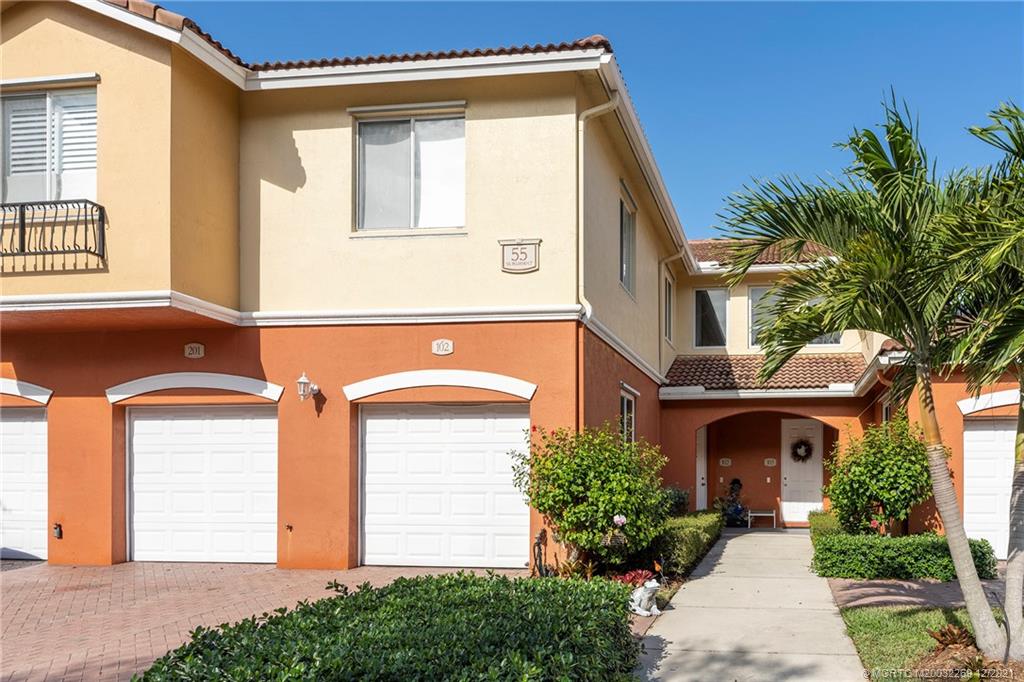 55 Southeast Palermo, Unit 102 Stuart, FL 34994 - Photo 4 of 40 a front view of a house with garden