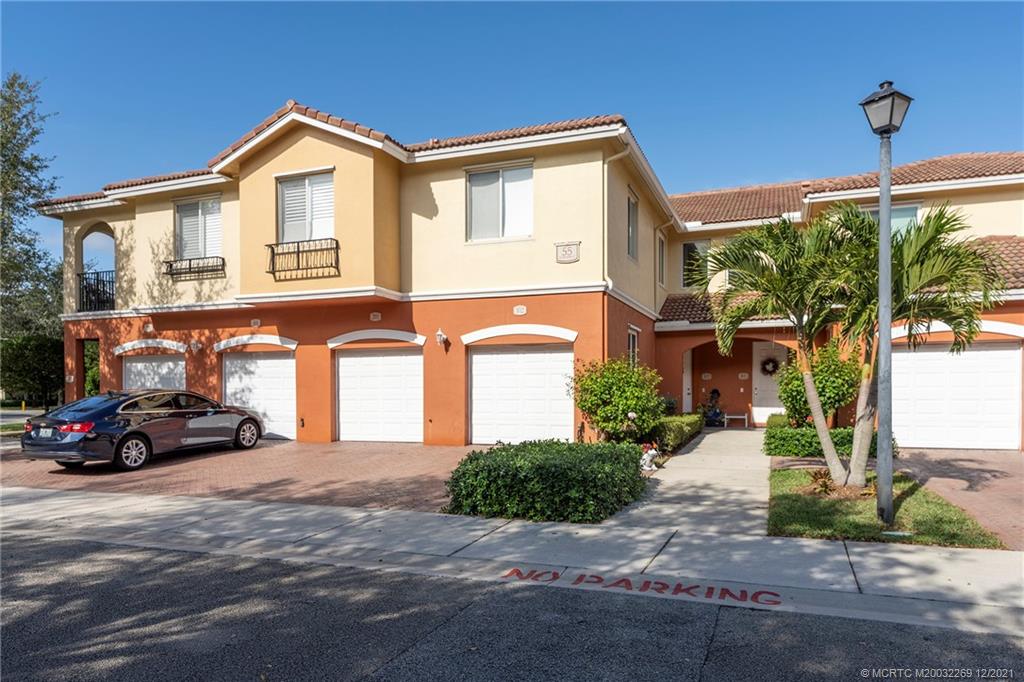 55 Southeast Palermo, Unit 102 Stuart, FL 34994 - Photo 5 of 40 a car parked in front of a house