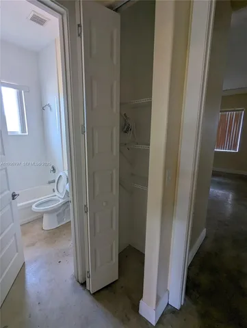 a bathroom with a bathtub and toilet