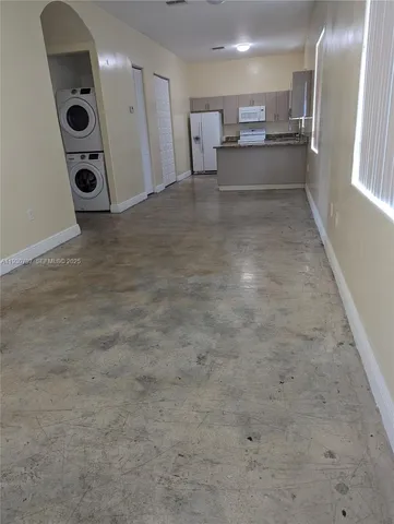a view of a storage & utility room with a sink