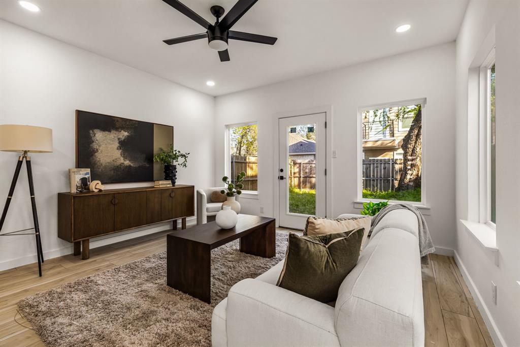2232 Hooper Street Dallas, TX 75215 - Photo 11 of 23 a living room with furniture and a flat screen tv