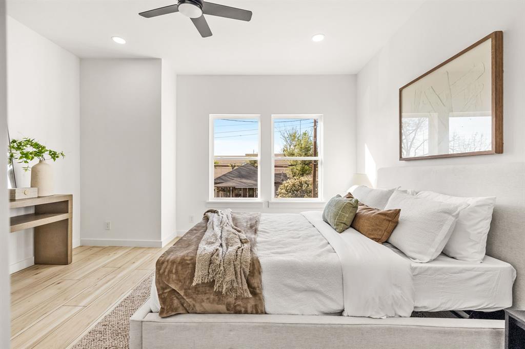 2232 Hooper Street Dallas, TX 75215 - Photo 15 of 23 a bedroom with a bed and ceiling fan