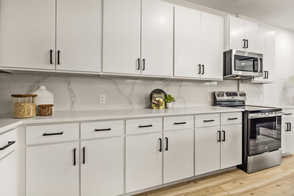 2232 Hooper Street Dallas, TX 75215 - Photo 7 of 23 a kitchen with white cabinets and appliances