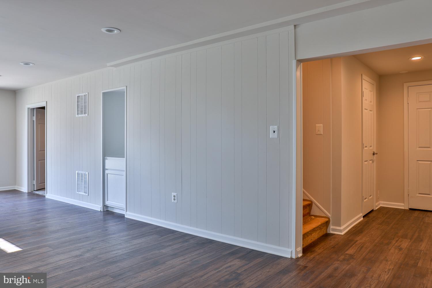 5423 Rilian Court Burke, VA 22015 - Photo 62 of 67 a view of an empty room with wooden floor
