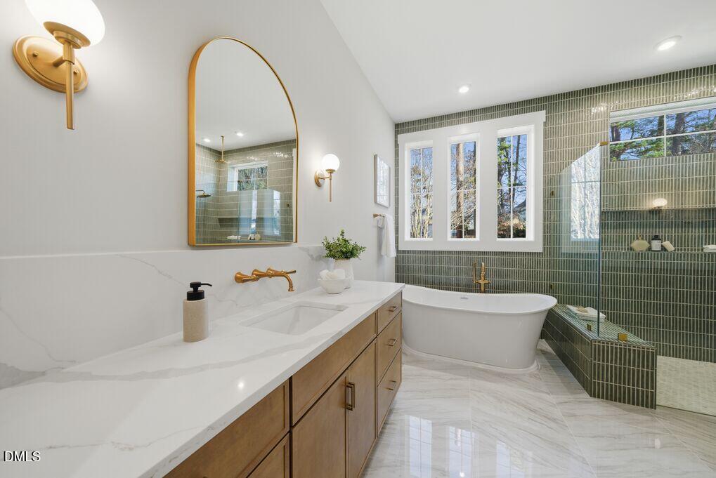 8729 Allison Road Cedar Grove, NC 27231 - Photo 21 of 63 a bathroom with a double vanity sink mirror and bathtub