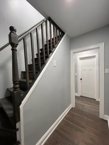 a view of hallway with wooden floor