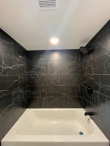a bathroom with a bathtub