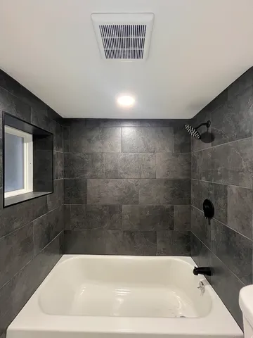 a bathroom with a bathtub