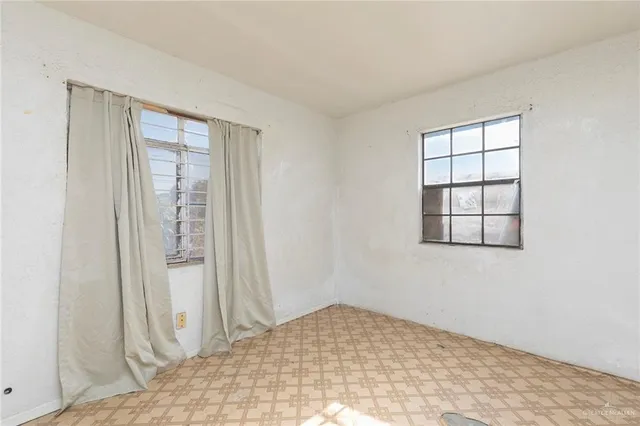 a view of a room that has a window in it