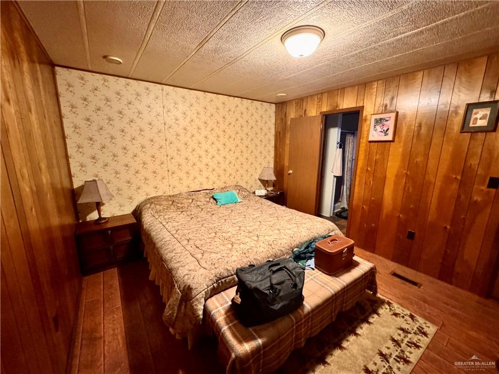 2112 Kelly Mission, TX 78572 - Photo 20 of 24 a bed sitting in a room next to a window