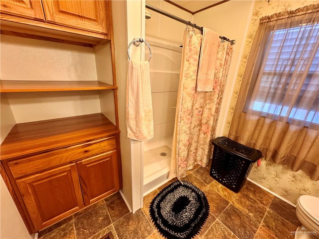 2112 Kelly Mission, TX 78572 - Photo 21 of 24 a bathroom with a sink and a shower