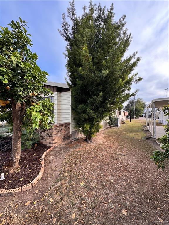 2112 Kelly Mission, TX 78572 - Photo 4 of 24 a view of a yard with plants and trees