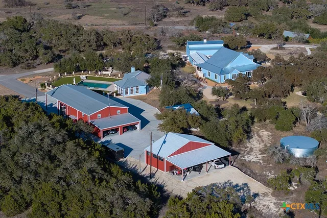 an aerial view of residential houses with outdoor space