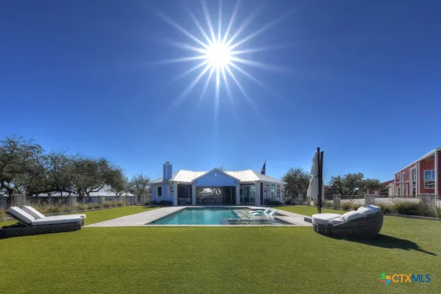 a view of swimming pool with outdoor space and seating area