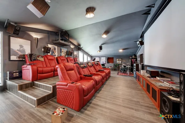 an aerial view of a house with a mountain