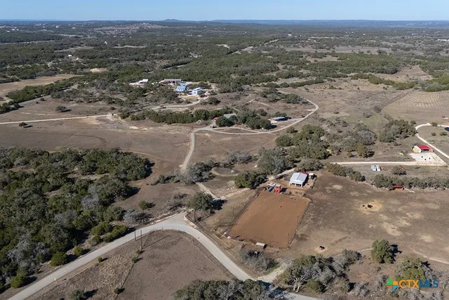 a backyard of a house with yard fire pit and outdoor seating
