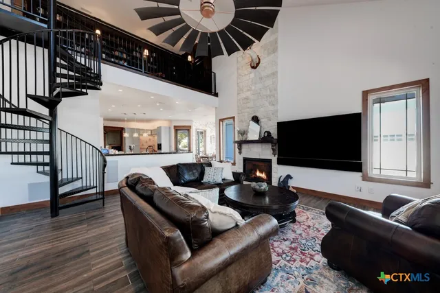 a view of a livingroom with furniture and bookshelf