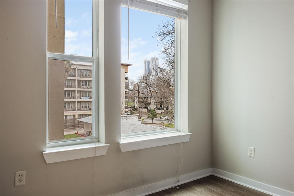 1900 Barton Springs Road, Unit 3013 Austin, TX 78704 - Photo 17 of 27 City views from large windows illuminate this versatile space, perfect for work or relaxation.