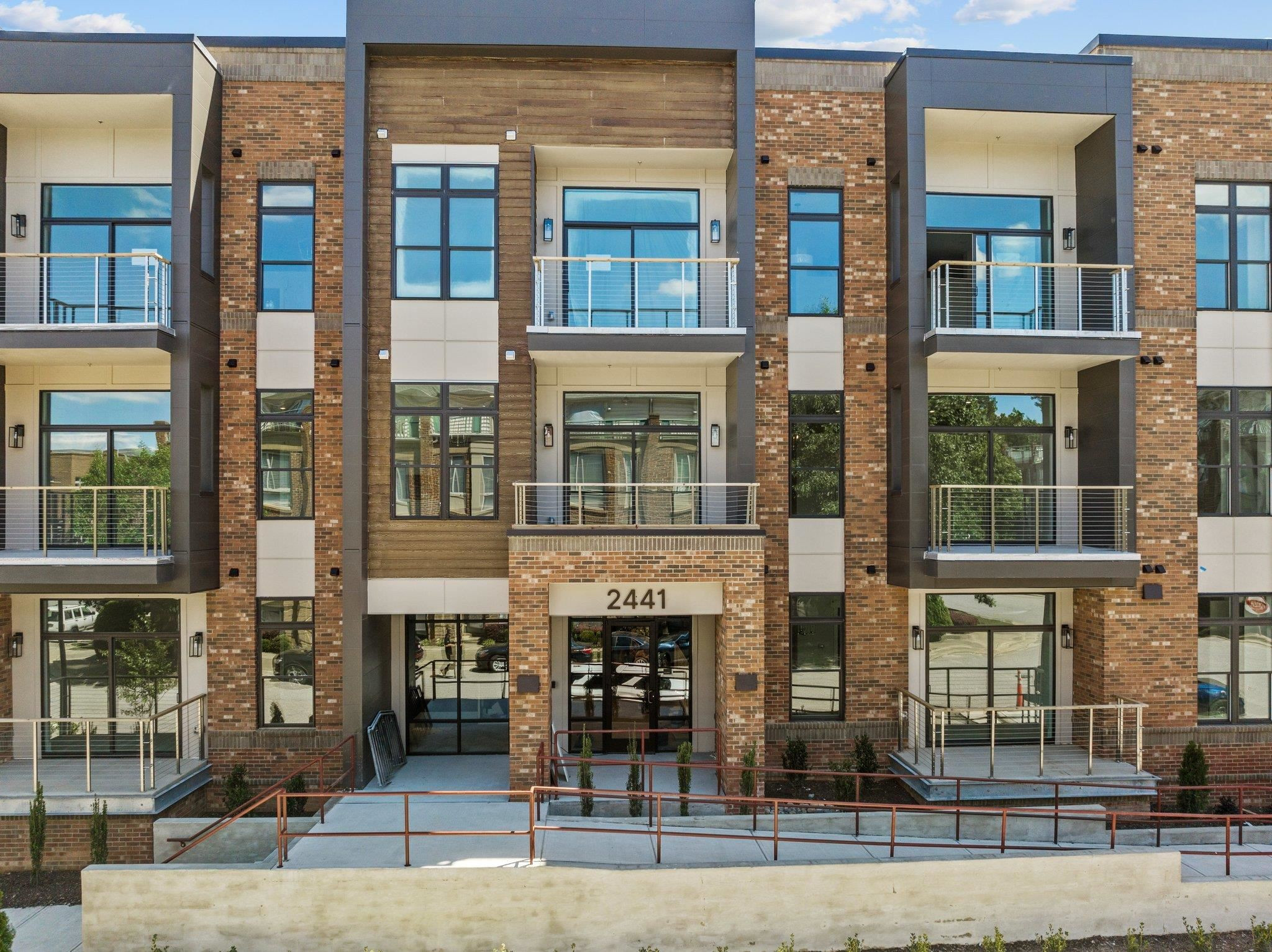 2441 Campus Shore Drive, Unit 312 Raleigh, NC 27606 - Photo 14 of 43 a front view of a building with street