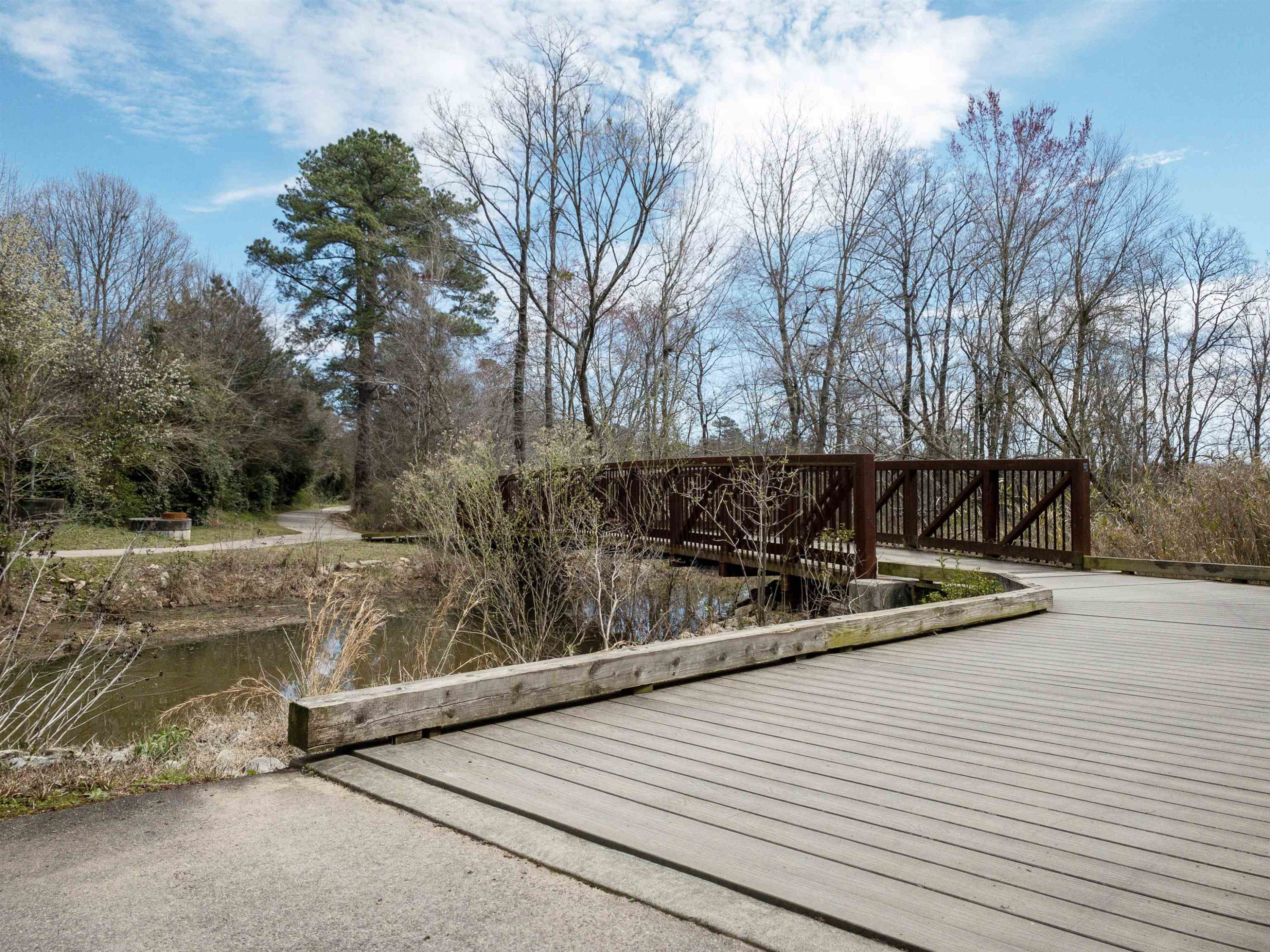 2441 Campus Shore Drive, Unit 312 Raleigh, NC 27606 - Photo 17 of 43 a view of a backyard with wooden fence