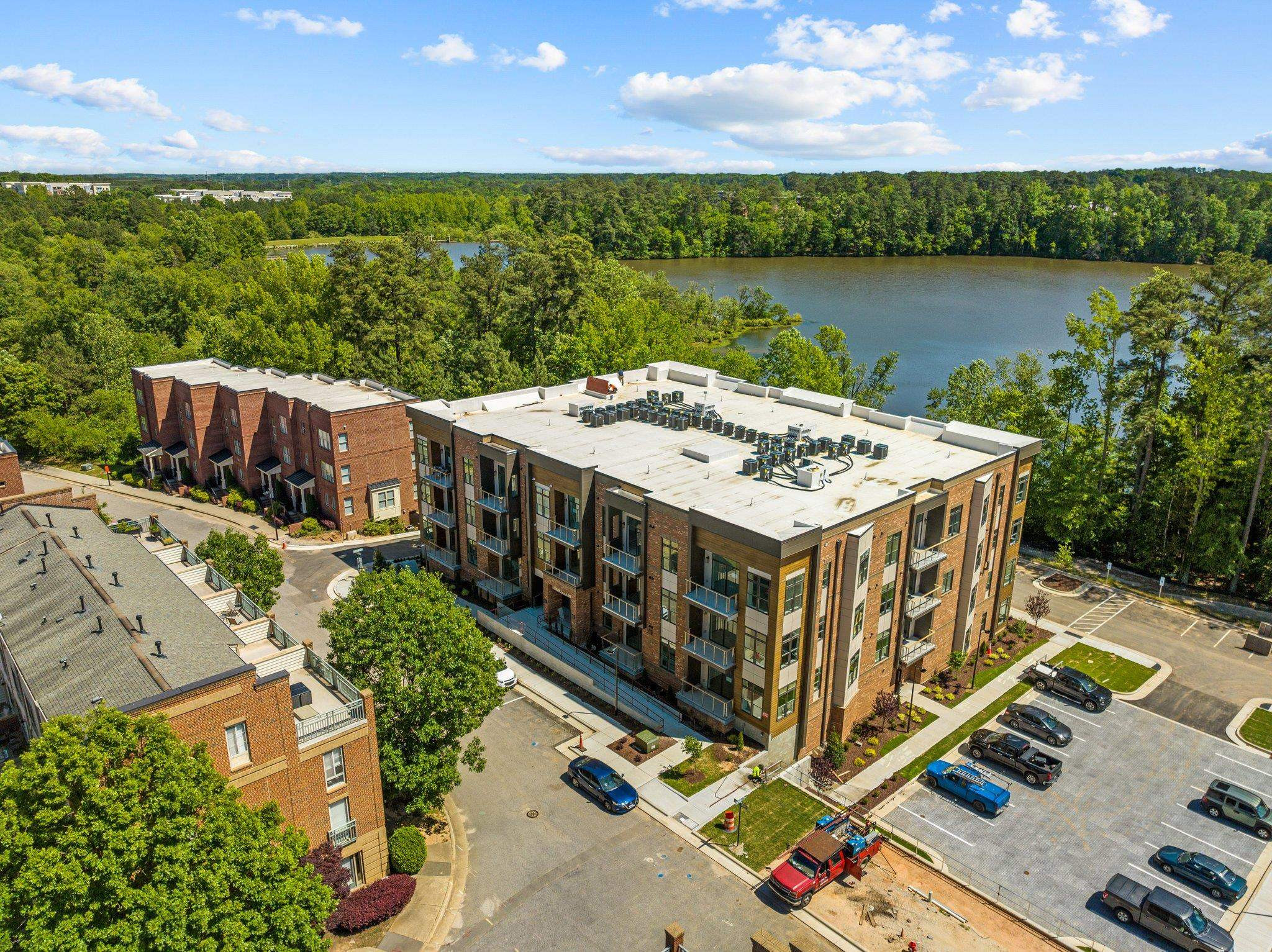 2441 Campus Shore Drive, Unit 312 Raleigh, NC 27606 - Photo 20 of 43 an aerial view of a house with a garden space and outdoor seating