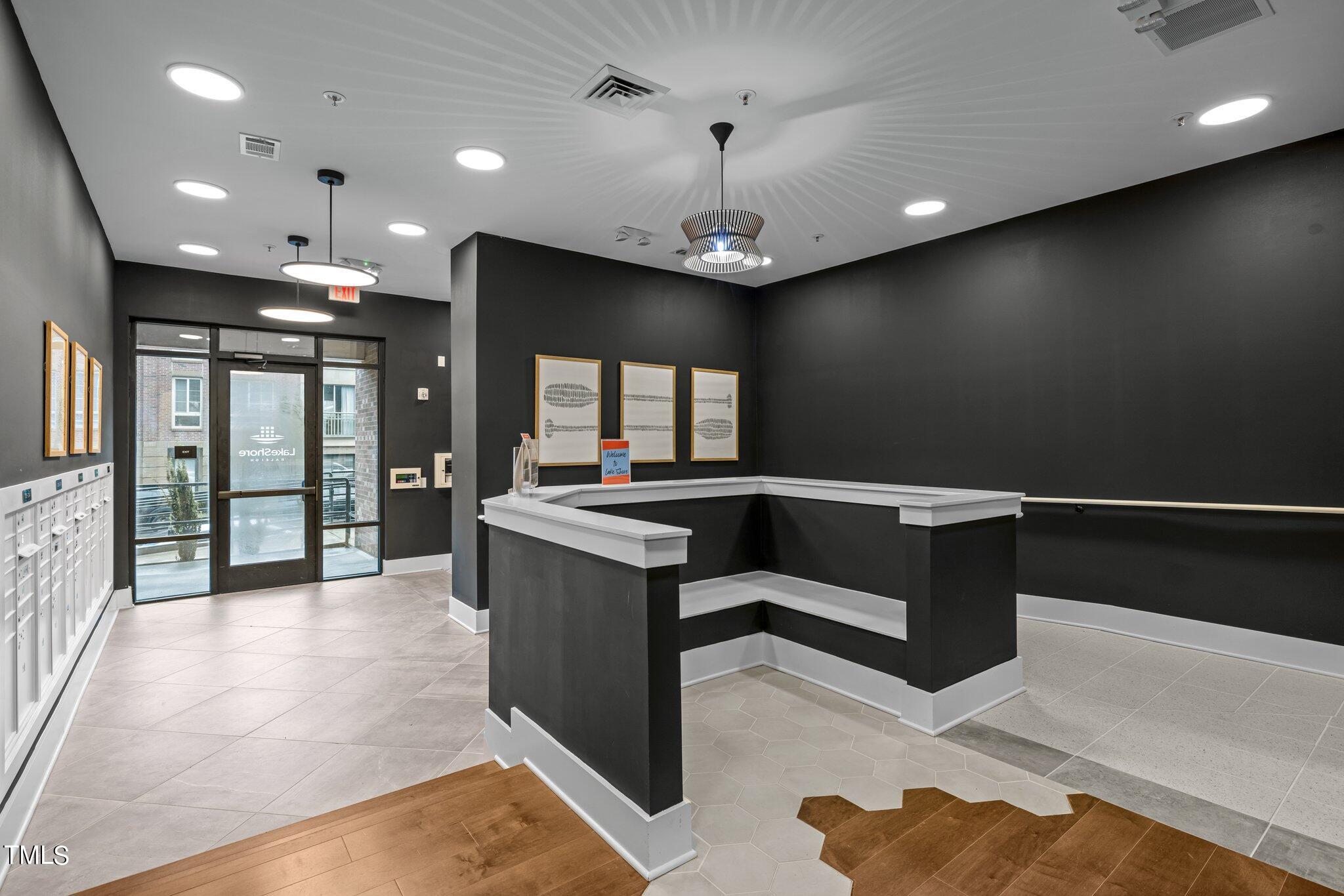 2441 Campus Shore Drive, Unit 312 Raleigh, NC 27606 - Photo 28 of 43 a large living room with a large window