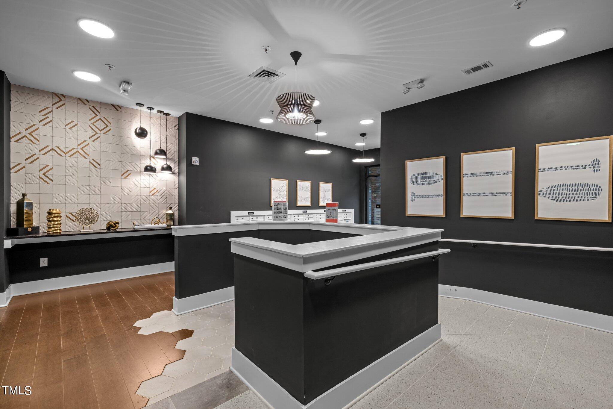 2441 Campus Shore Drive, Unit 312 Raleigh, NC 27606 - Photo 29 of 43 a kitchen with stainless steel appliances granite countertop a stove and a sink