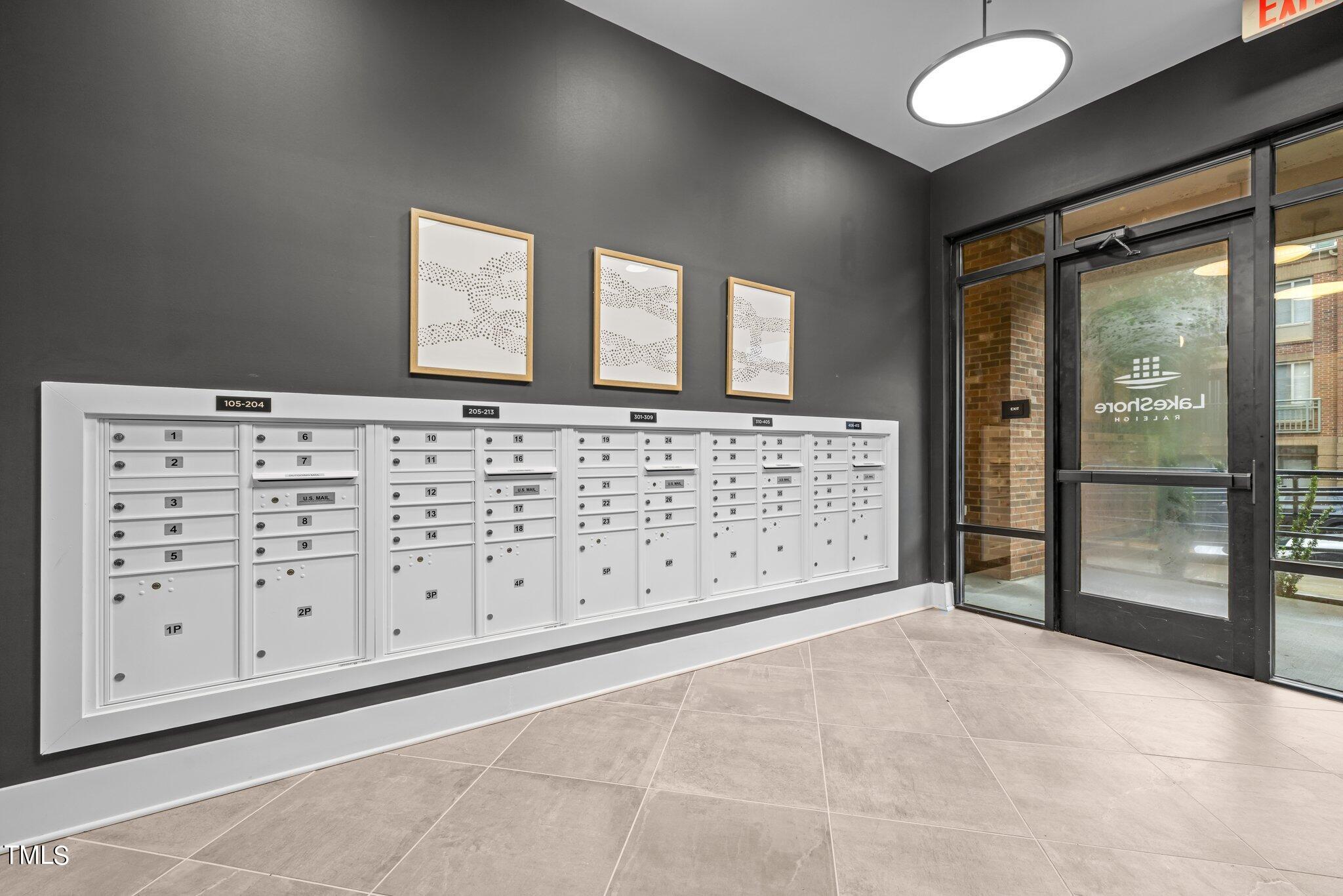 2441 Campus Shore Drive, Unit 312 Raleigh, NC 27606 - Photo 30 of 43 a spacious bedroom with a large bed and a dresser