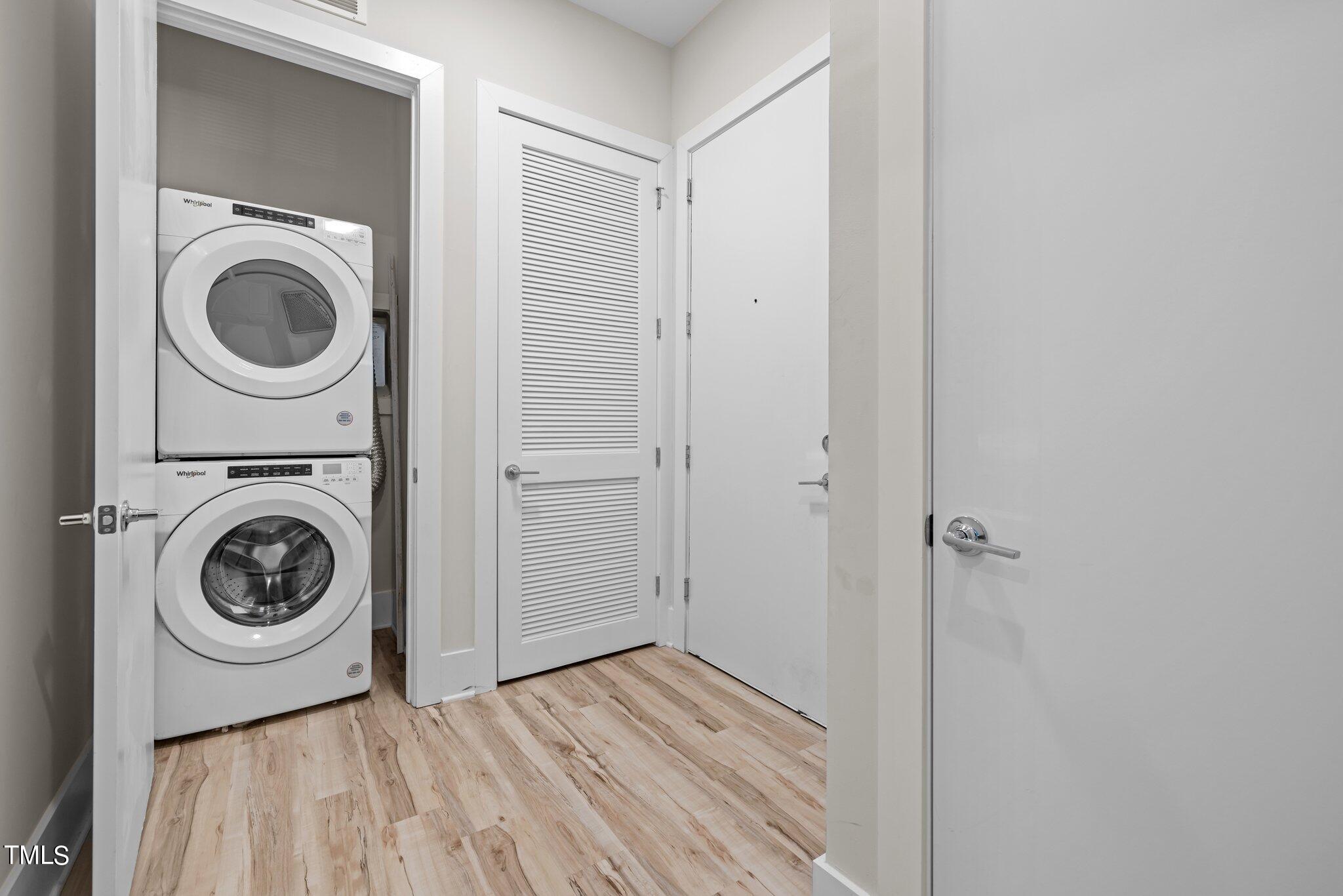 2441 Campus Shore Drive, Unit 312 Raleigh, NC 27606 - Photo 32 of 43 a view of a bedroom with washer and dryer