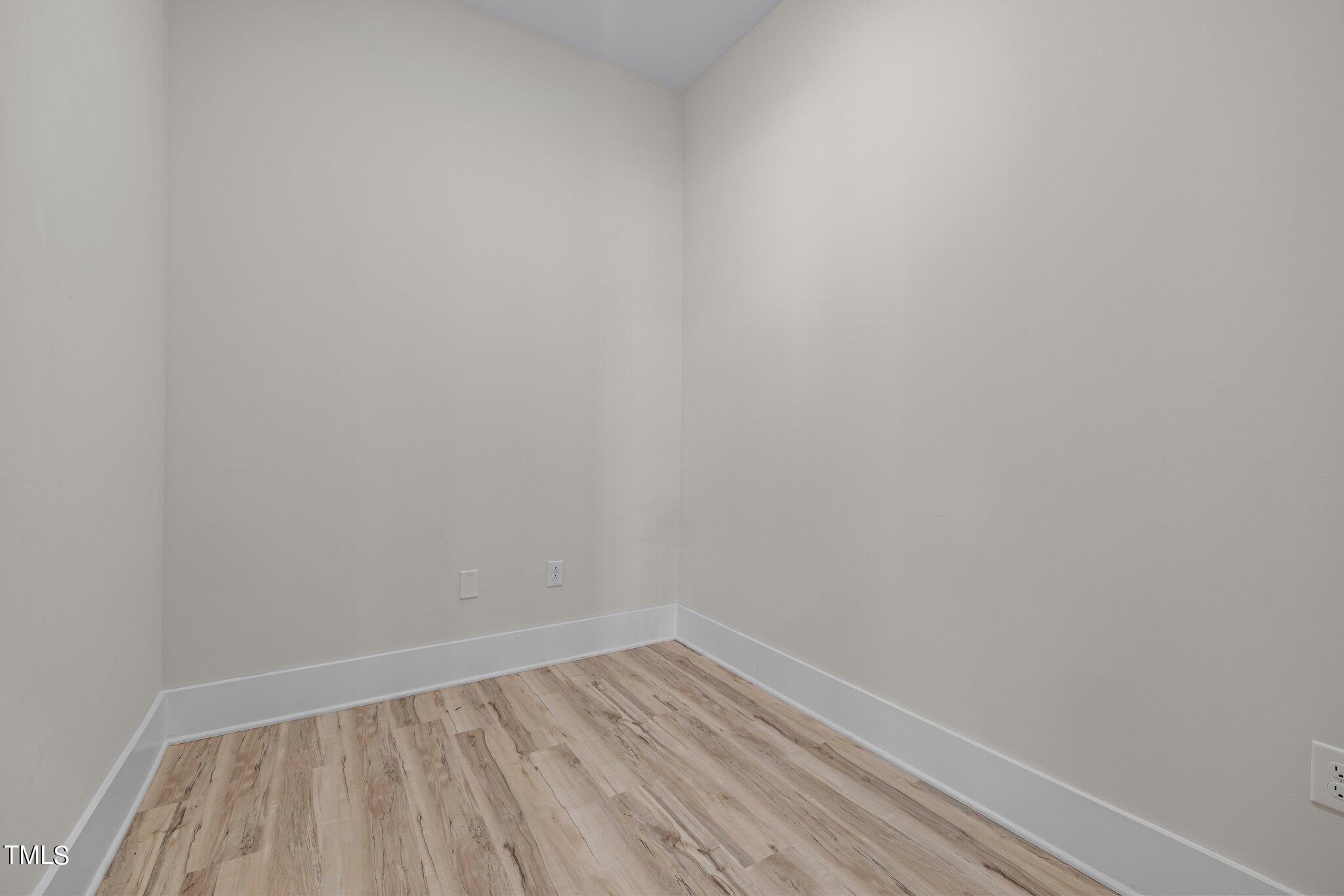 2441 Campus Shore Drive, Unit 312 Raleigh, NC 27606 - Photo 34 of 43 a view of an empty room and wooden floor