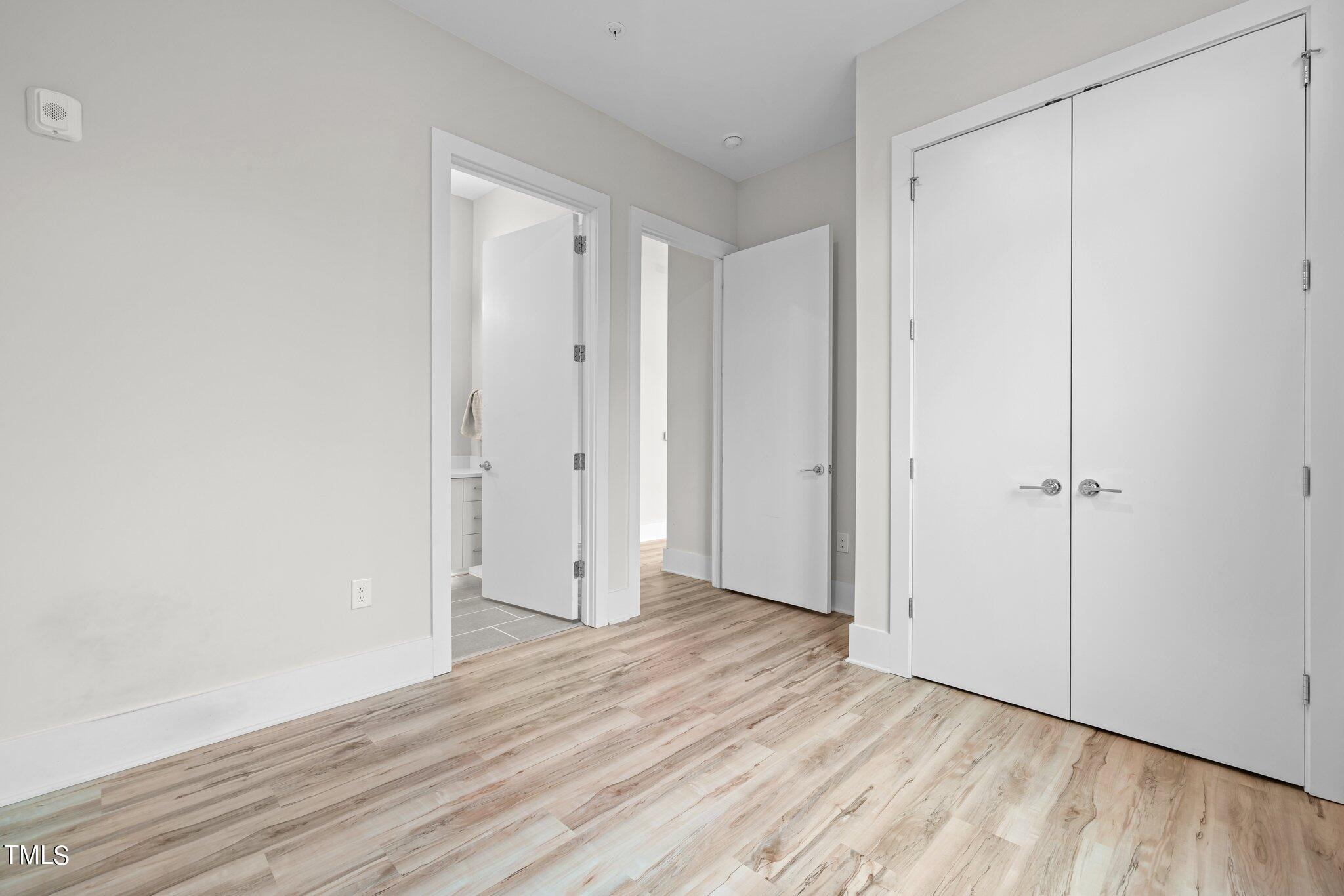 2441 Campus Shore Drive, Unit 312 Raleigh, NC 27606 - Photo 36 of 43 a view of an empty room and wooden floor