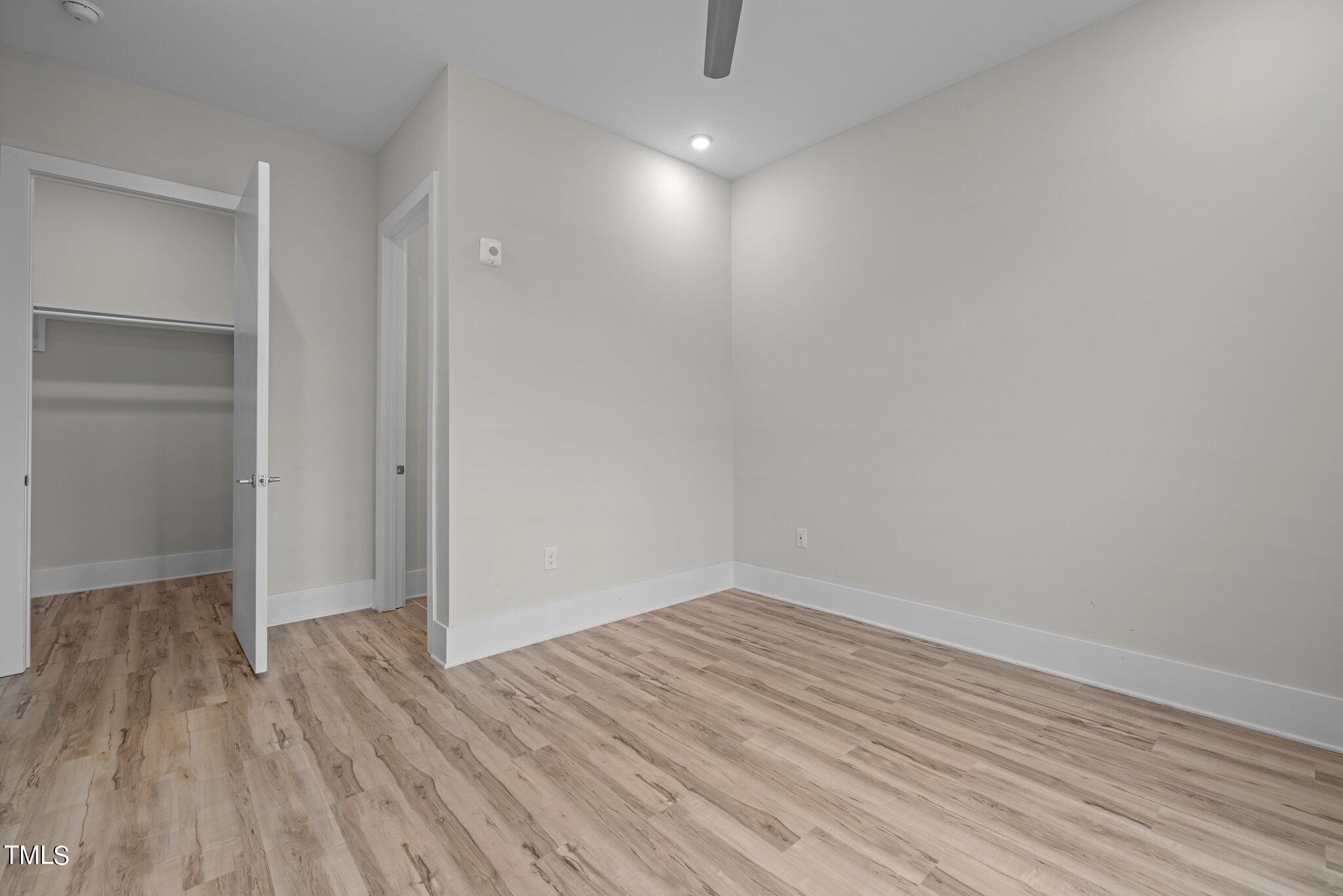 2441 Campus Shore Drive, Unit 312 Raleigh, NC 27606 - Photo 37 of 43 a view of room with wooden floor