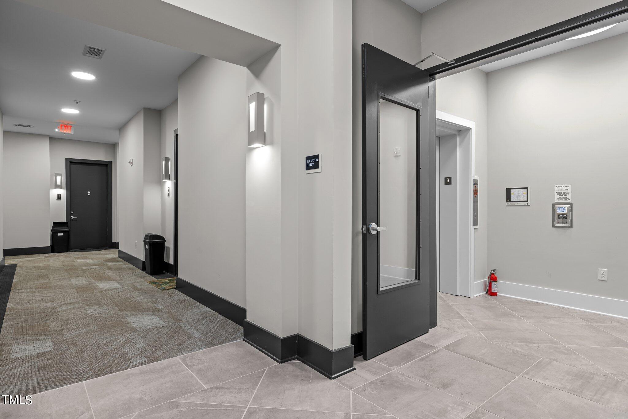 2441 Campus Shore Drive, Unit 312 Raleigh, NC 27606 - Photo 43 of 43 a view of a hallway with wooden shelves