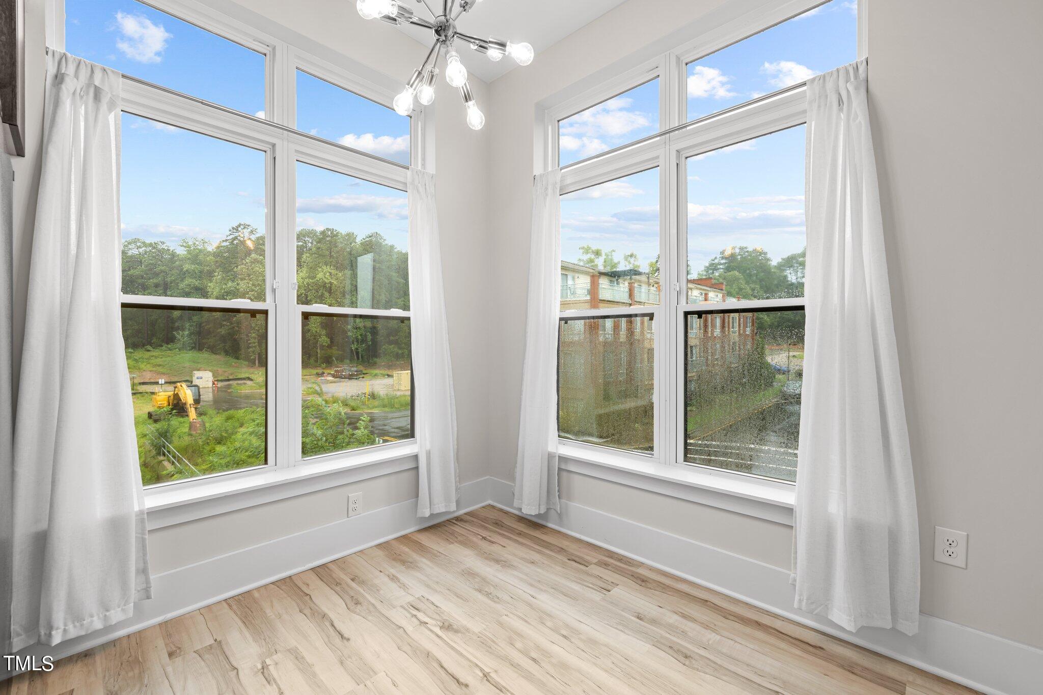2441 Campus Shore Drive, Unit 312 Raleigh, NC 27606 - Photo 7 of 43 a view of an empty room with a window