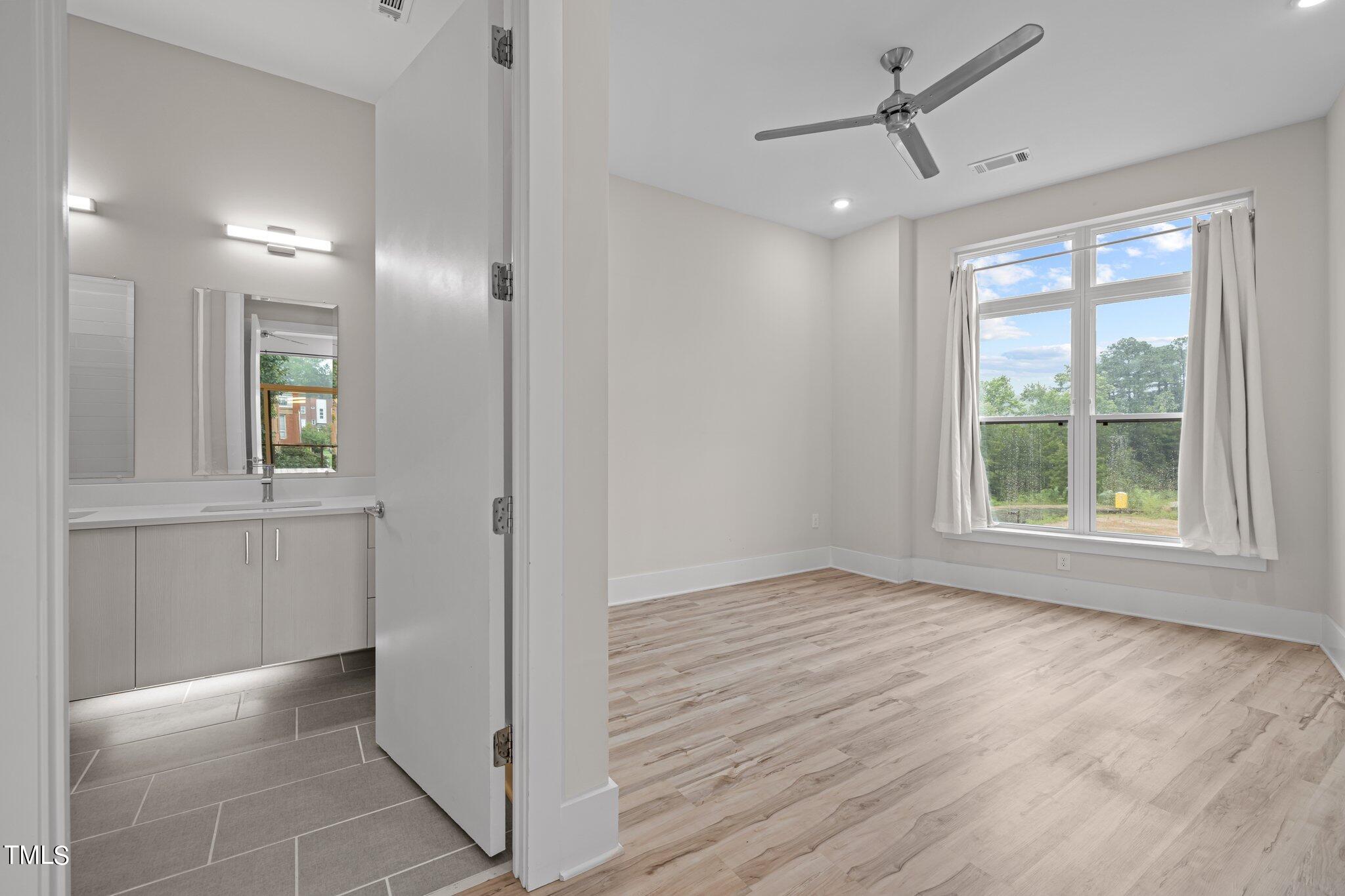 2441 Campus Shore Drive, Unit 312 Raleigh, NC 27606 - Photo 10 of 43 a view of livingroom with hardwood