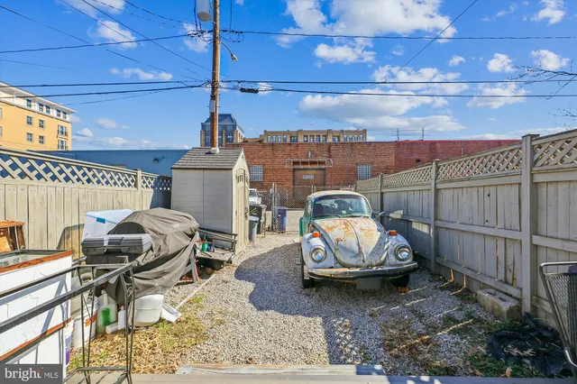 a group of people sitting in front of a building