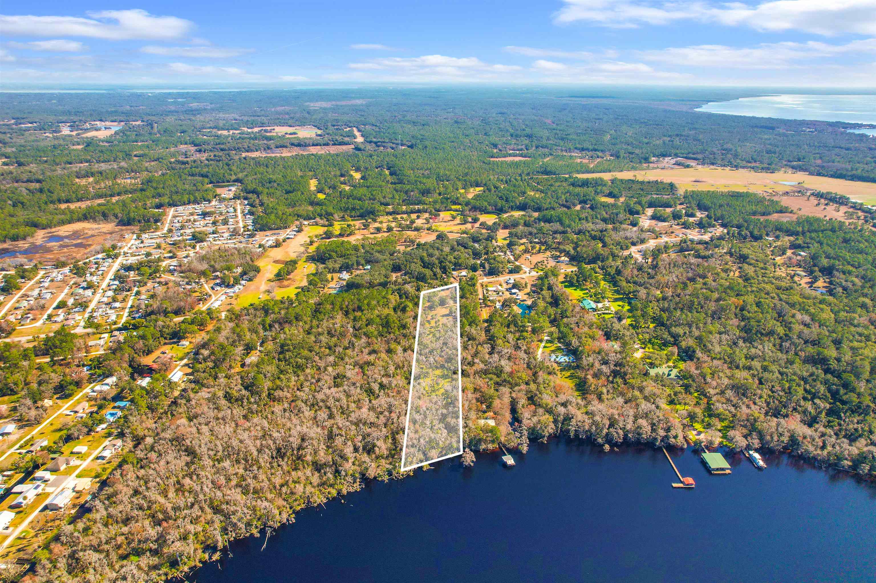 1249 County Rd Crescent, Unit 309 Crescent City, FL 32112 - Photo 22 of 23 a view of a city with an ocean