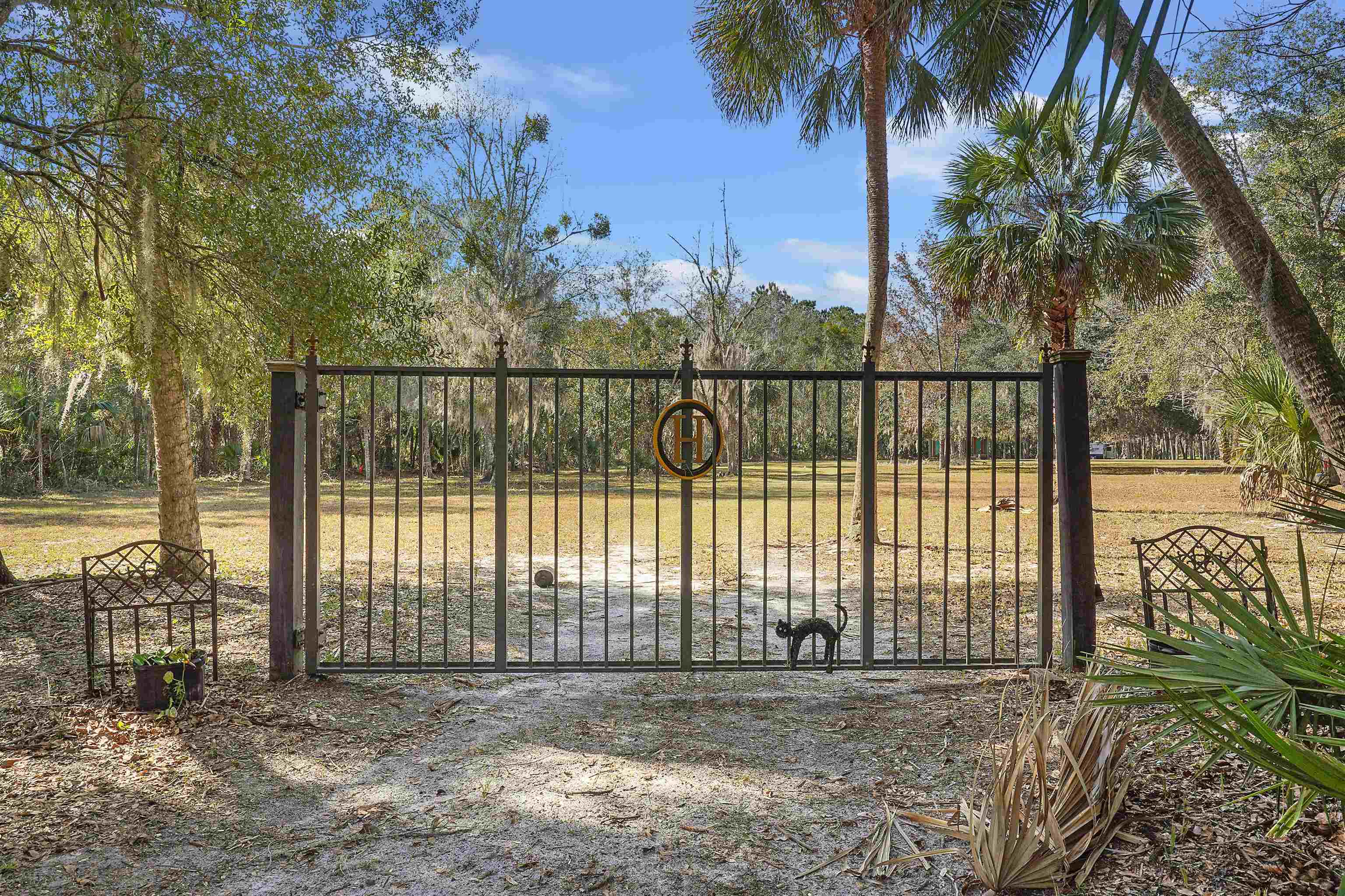 1249 County Rd Crescent, Unit 309 Crescent City, FL 32112 - Photo 6 of 23 a view of a wrought iron fences in front of house