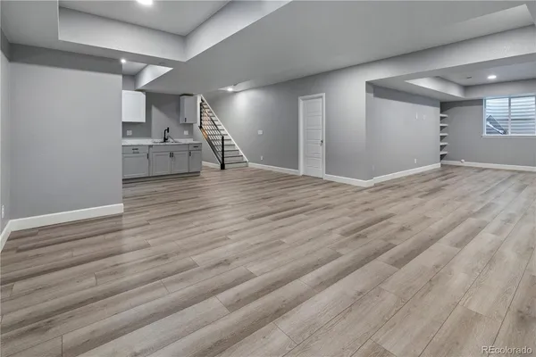 a kitchen with a sink cabinets and stainless steel appliances