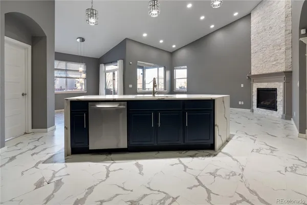 a kitchen with a sink and cabinets