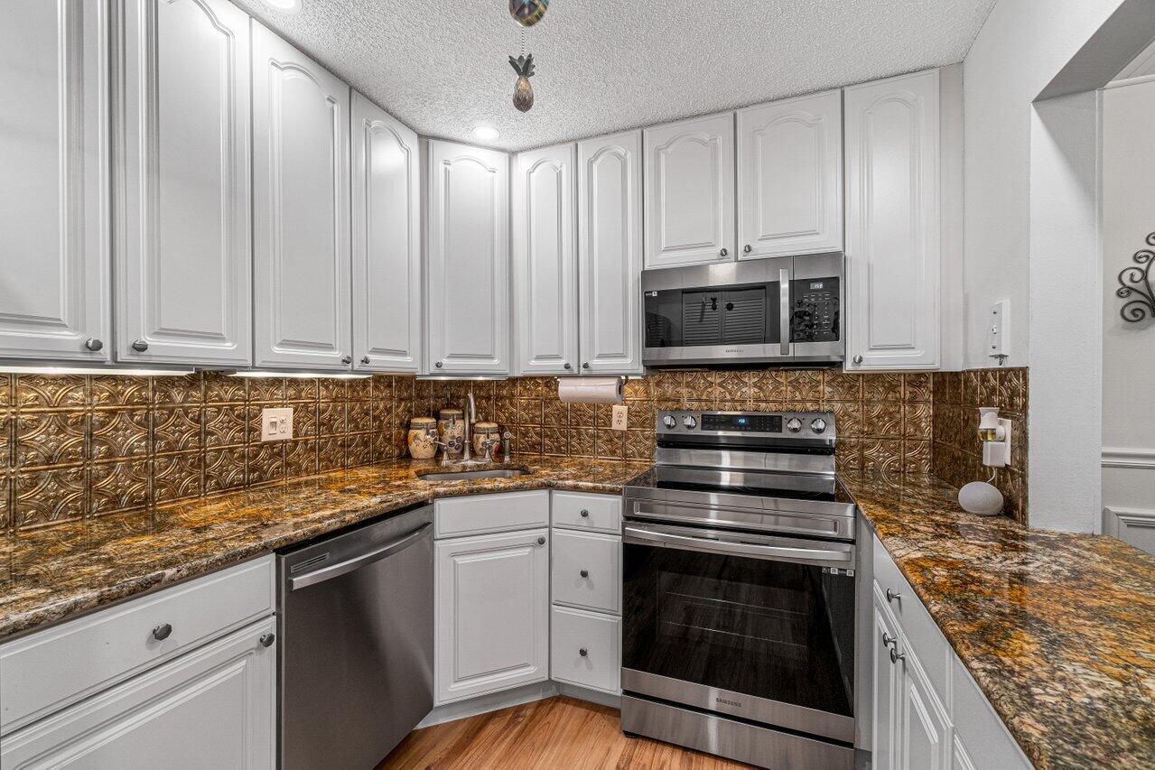 308 Pine Ridge Circle, Unit C2 Greenacres, FL 33463 - Photo 13 of 23 Kitchen
