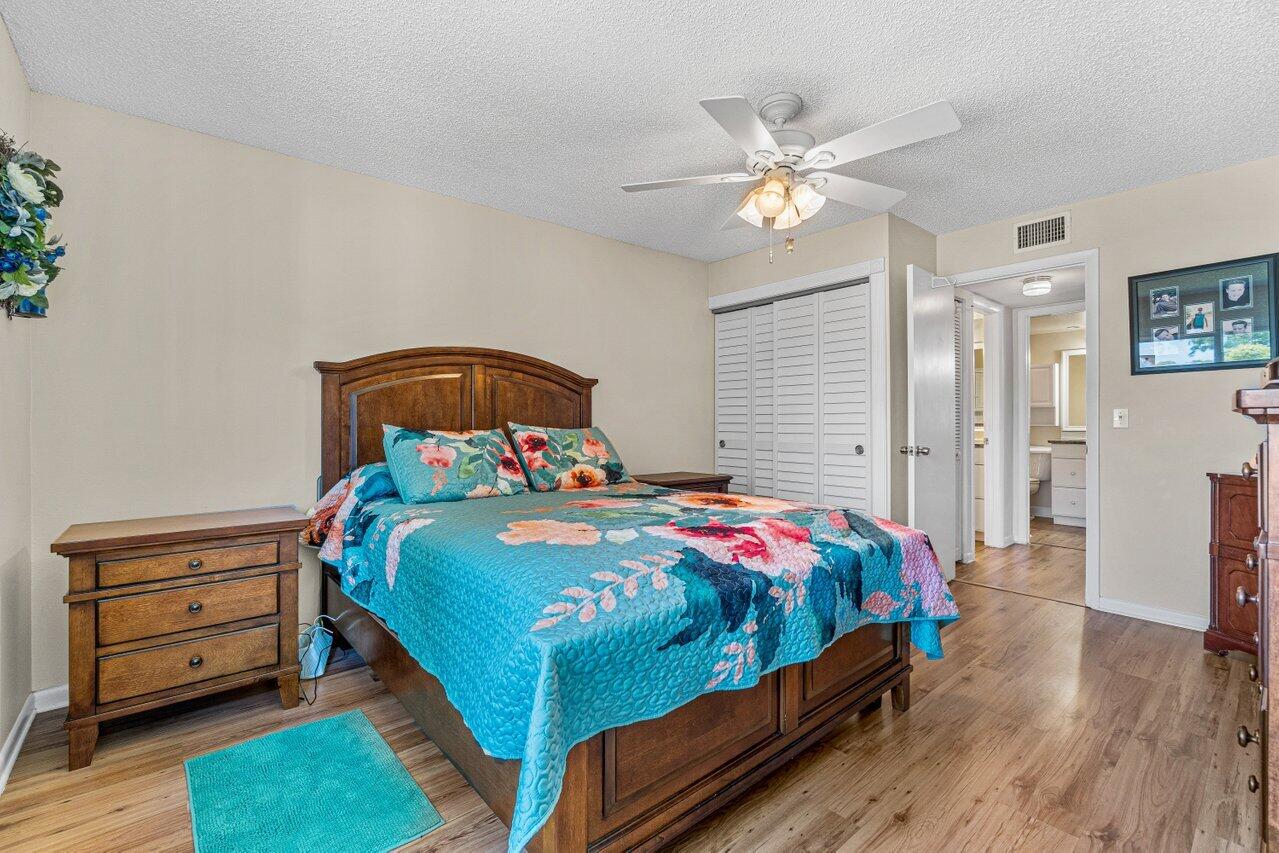 308 Pine Ridge Circle, Unit C2 Greenacres, FL 33463 - Photo 17 of 23 Primary Bedroom