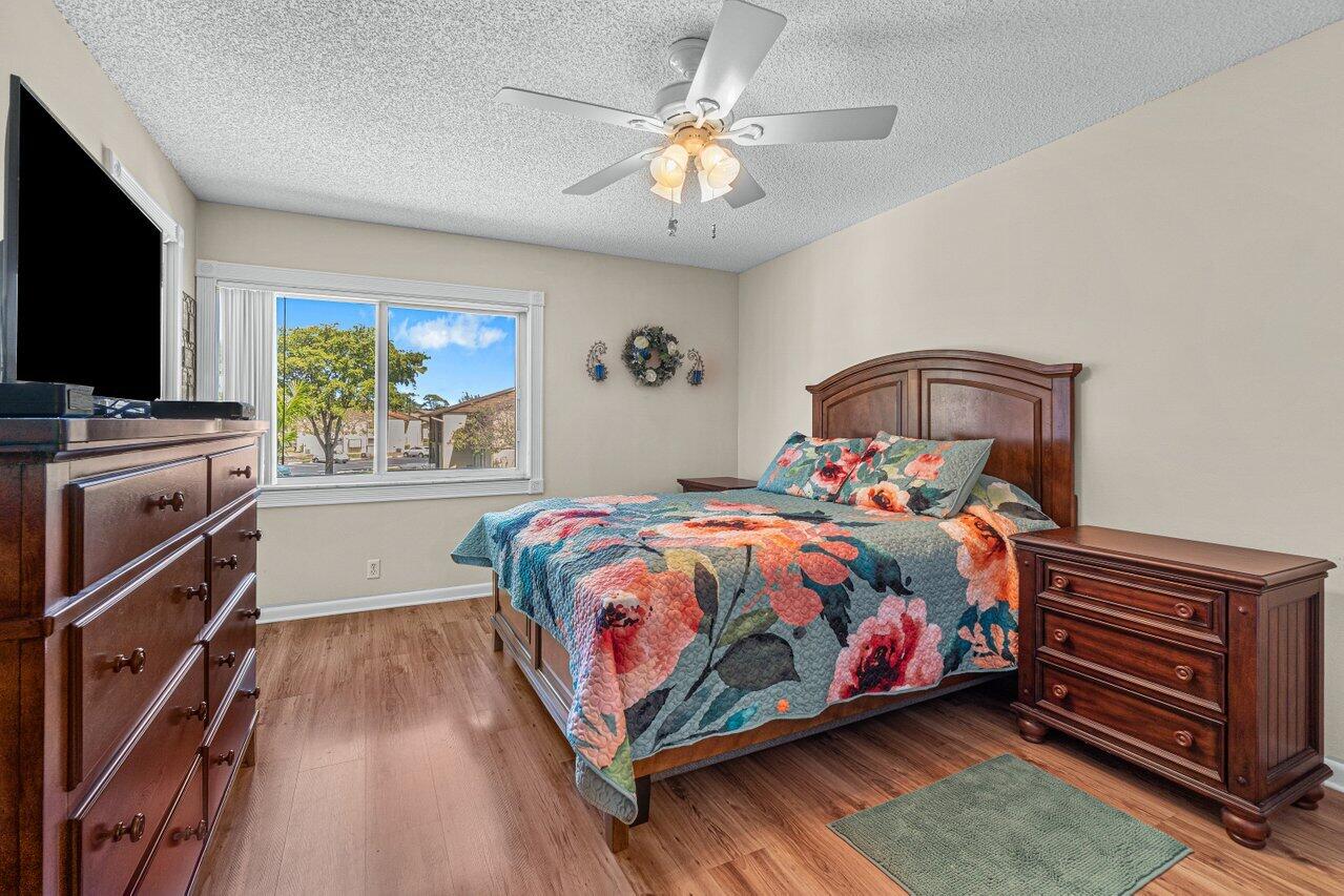 308 Pine Ridge Circle, Unit C2 Greenacres, FL 33463 - Photo 18 of 23 Primary Bedroom