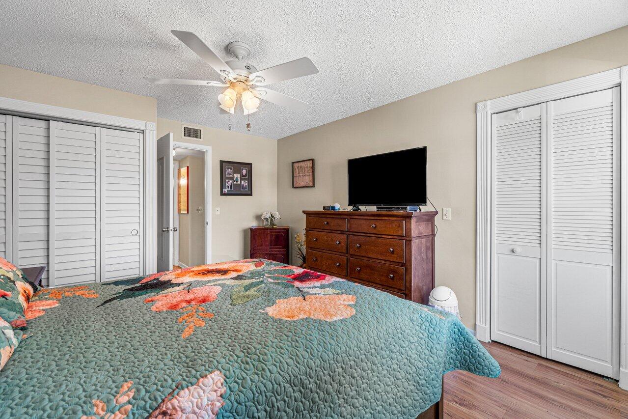308 Pine Ridge Circle, Unit C2 Greenacres, FL 33463 - Photo 19 of 23 Primary Bedroom